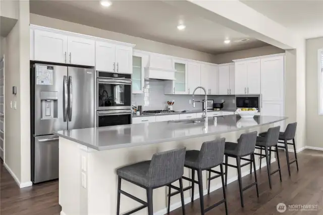 Oversized kitchen island, looking out over living space. Entertainers dream!