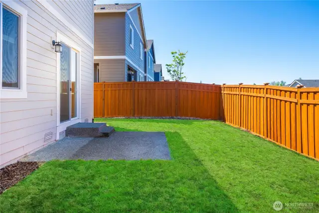 Flat yard, with plenty of privacy from backdoor neighbor. It is a blank canvas.
