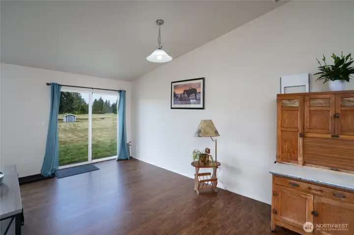 Dining room with slider that opens to backyard.
