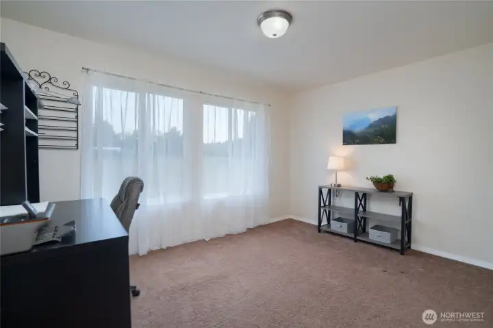 Bedroom 1, currently in use as an office space.