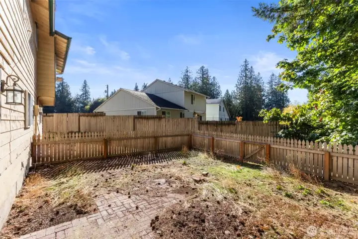 Smaller fenced section right outside back door.