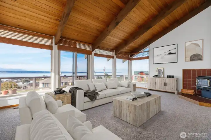 Virtually staged. A row of windows to showcase the views. Whales, eagles, and sailboats - nature on display.