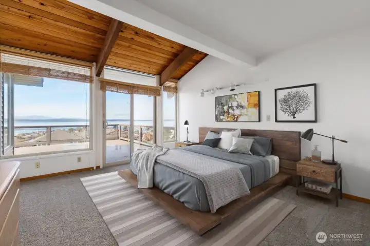 Virtually staged. Peaceful primary suite overlooking the water.