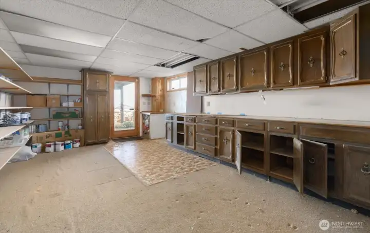 Lower level shop with abundant storage space.