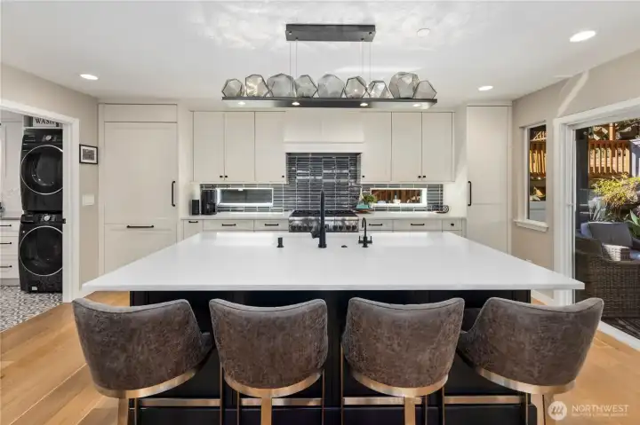 Kitchen with quartz counters, custom soft-close cabitenary, stainless steel appliances and much more.