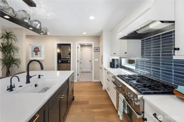 Kitchen with quartz counters, custom soft-close cabitenary, stainless steel appliances and much more.