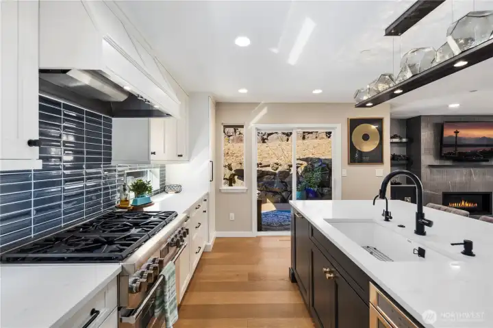 Kitchen with quartz counters, custom soft-close cabitenary, stainless steel appliances and much more.