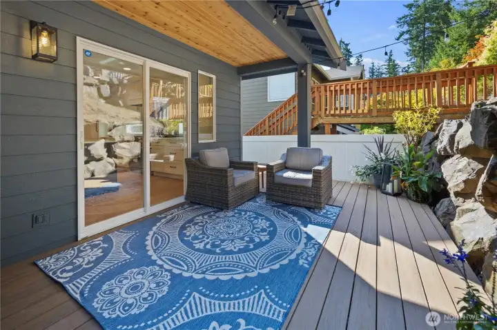 Deck with covered sitting area.