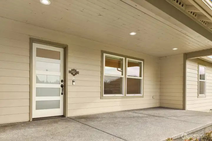 Plenty of room out front for porch-swing or rocking-chair living, plus a covered patio that’s perfect for relaxing rain or shine. It’s an ideal setup for enjoying the quiet, private corner-lot setting.