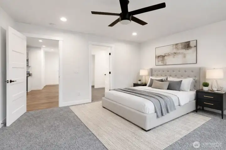 Virtually staged.  The primary bedroom is thoughtfully located on the opposite side of the home for added privacy and features an attached bath en-suite, large walk-in closet, double-sink vanity, and granite counters.