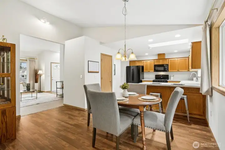 Great dining area situated between the kitchen and family room, just inside the sliding door to the backyard.