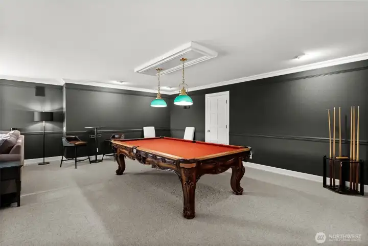New paint and carpet in this spacious game room with pool table and wet bar (pool table conveys).