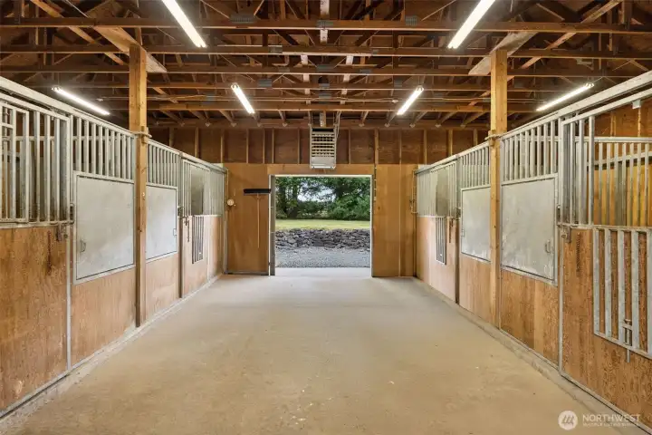 Horse stalls in the heated barn are made with galvanized steel, so they will never rust. There is also a tack room, hay feeders, hot/cold wash room and bathroom.