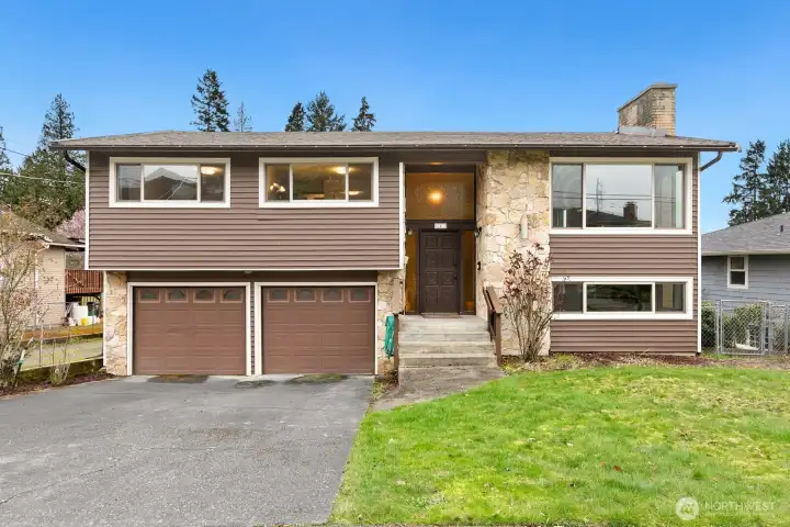 Welcome to your new home! 2-Car Garage and stately stone entry.