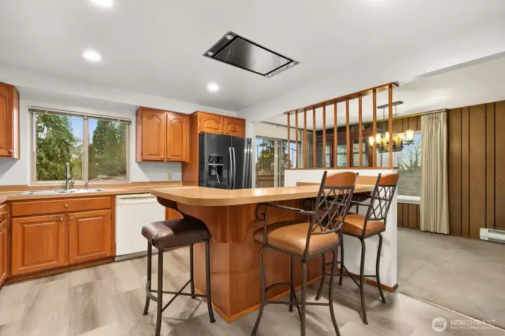 Kitchen with bar-height counter is a great place for a quick meal.