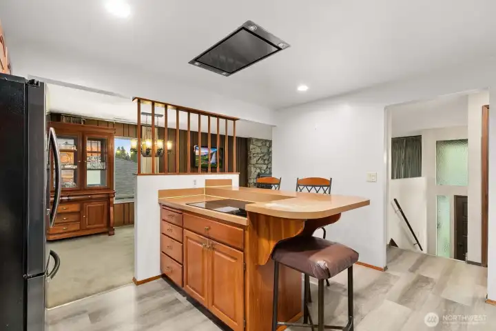 Kitchen is located at the top of the stairs, next to the dining room.