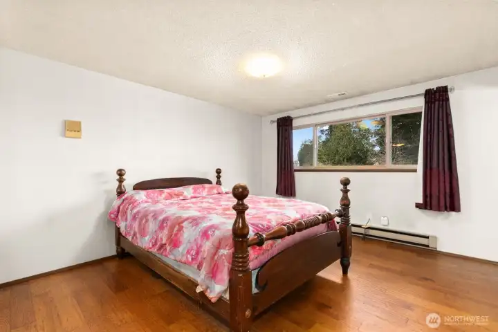 Primary bedroom overlooks private back yard.
