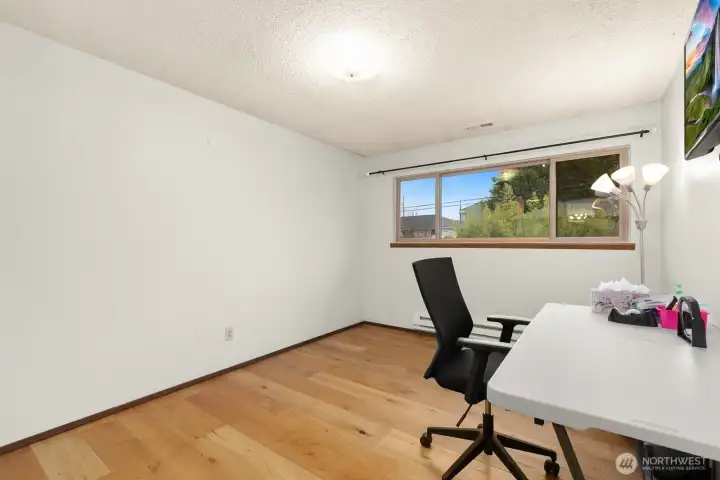 Third Bedroom is currently being used as an office and also includes a wall-mounted TV.