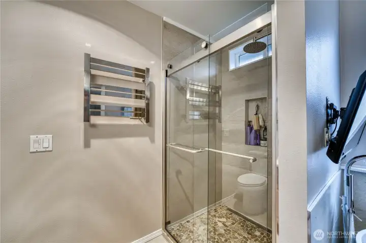 Newly tiled shower & heated towel rack