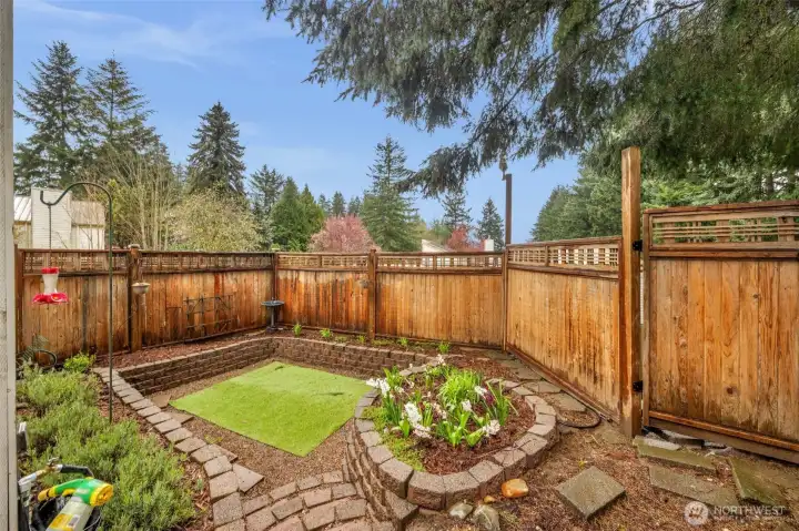 Fenced yard with landscaped courtyard
