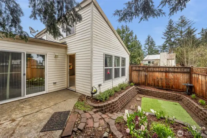 Fenced yard with landscaped courtyard