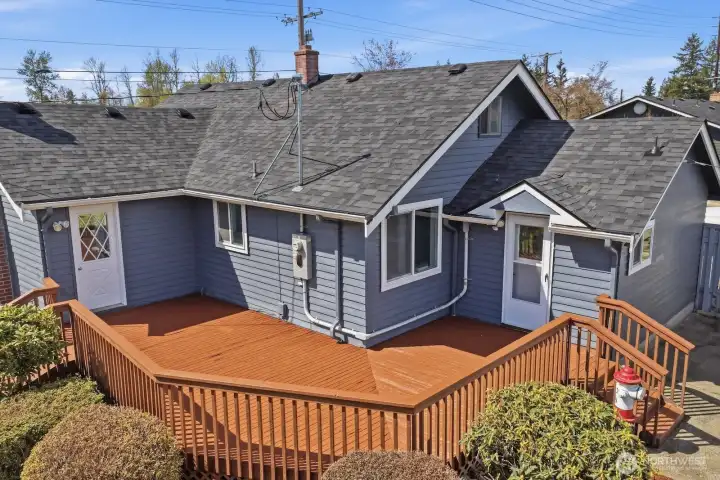 The oversized, freshly stained deck is an entertainer's dream, offering a sprawling platform to host summer BBQs against a backdrop of open pastures and quiet surroundings.