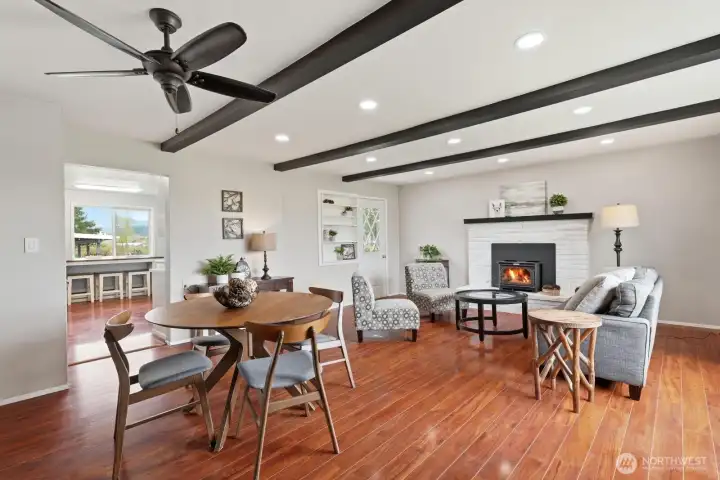 Beams & Character: Vaulted ceilings with exposed wood beams add architectural interest and a warm, lodge-like feel to the heart of the home.