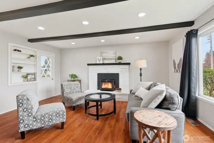 The Fireplace Focal Point: The classic wood-burning fireplace serves as a cozy centerpiece, perfect for chilly Enumclaw evenings.