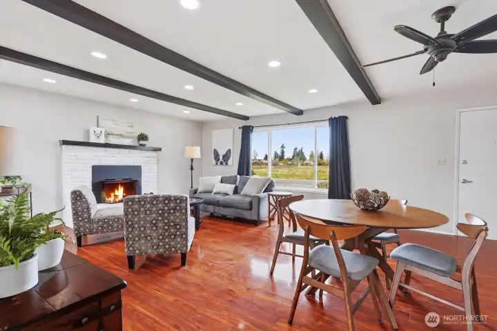 Versatile Layout: The expansive "great room" design is spacious enough to comfortably accommodate both a full sofa seating area and a formal dining set.