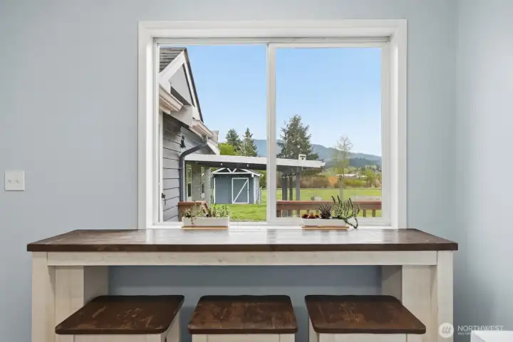 Morning Views: The casual dining area is perfectly positioned to overlook the backyard and pasture, offering a peaceful view of your acreage while you enjoy your morning coffee.