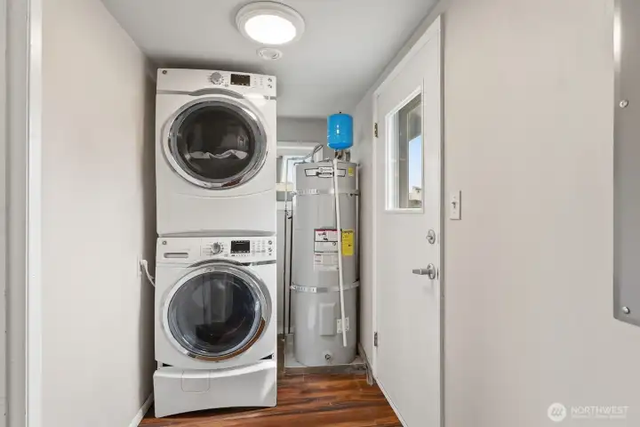 Dedicated Laundry Space: This separate, dedicated laundry room offers a functional layout that keeps household tasks organized and tucked away from the main living areas.