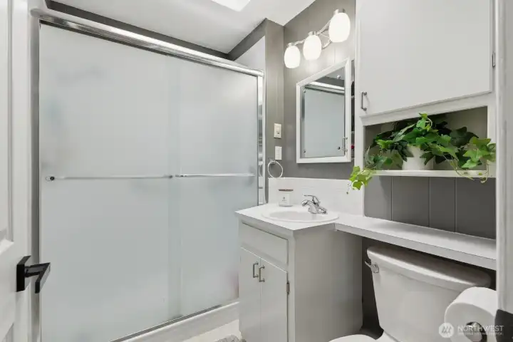 The full bathroom was tastefully updated in 2019, featuring clean lines and contemporary finishes that maintain the home's move-in-ready appeal.