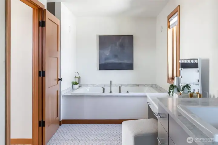 Carrara marble countertops and shower tile