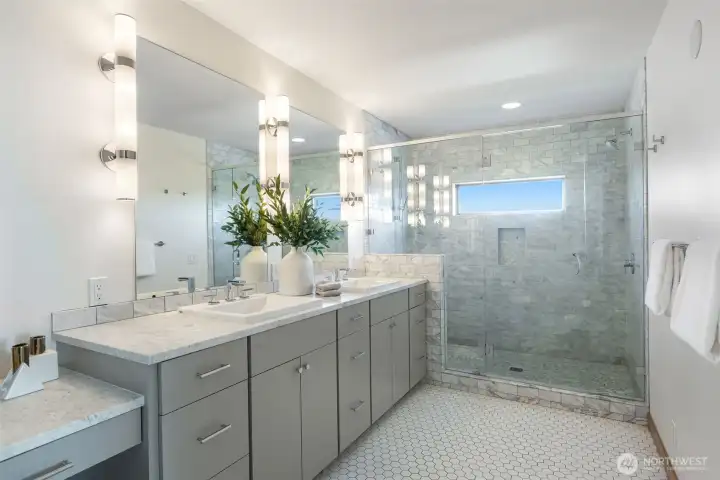 Carrara marble countertops and shower tile, plus heated floors