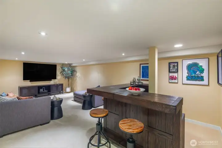 Lower level offers generous space for a media lounge with bar, flexible bonus area, and a sauna ready to be reconnected