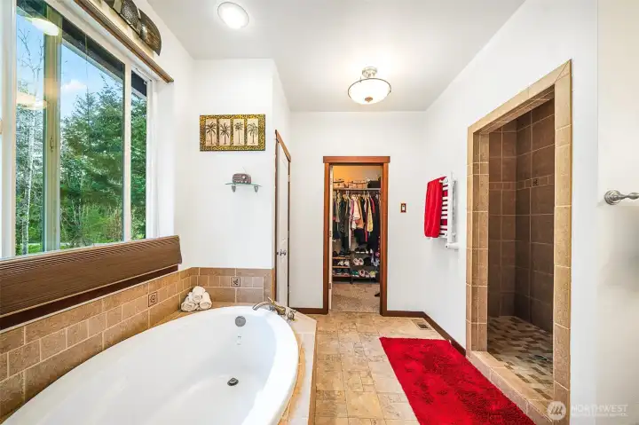 Large walk-in shower and heated towel rack.