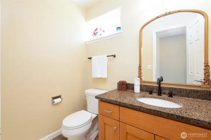 Down Stairs 3/4 - Bathroom - with Granite Countertops; and access from both the primary room and the hallway.