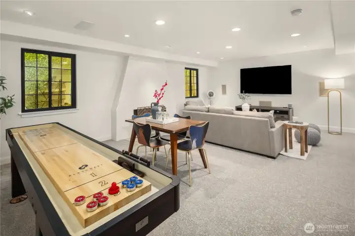 Large lower level rec-room has carpet, fireplace and lots of canned lights to give it a bright happy feel. Large lower level rec-room has carpet, fireplace and lots of canned lights to give it a bright happy feel.