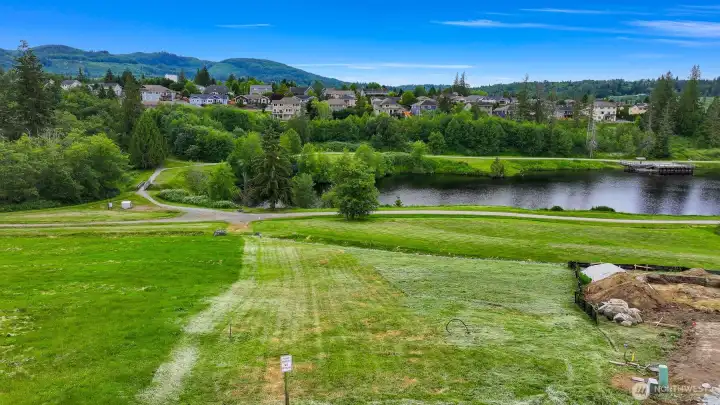 Taken from the top of the future driveway, looking West. Property slopes down toward the pond. Taken from the top of the future driveway, looking West. Property slopes down toward the pond.