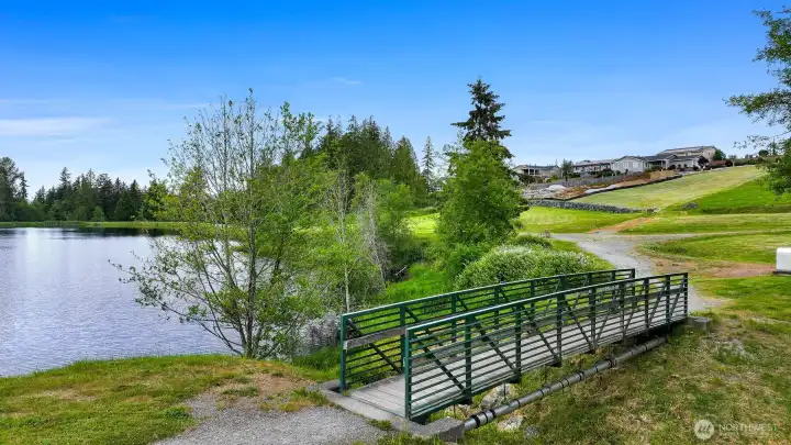 Another view of the footbridge, with the property ahead. This picture gives you a good idea of the slope of the property's terrain. Another view of the footbridge, with the property ahead. This picture gives you a good idea of the slope of the property's terrain.
