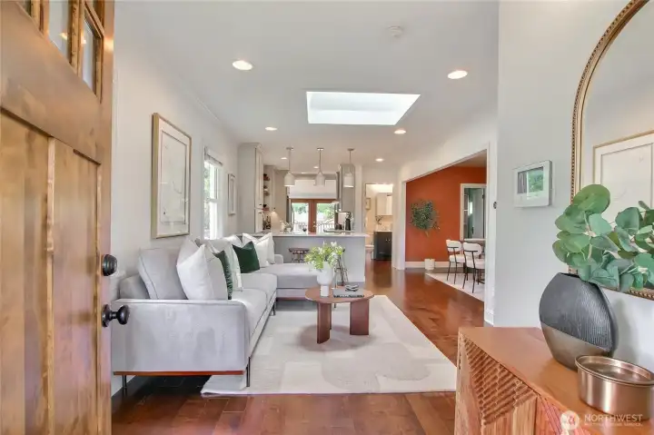 Enter into an open floor plan space that connects living, dining and kitchen for the homeowners and their guests.