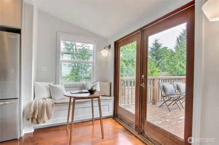 Breakfast nook adds even more versatility to this upstairs space, beside your backyard deck.