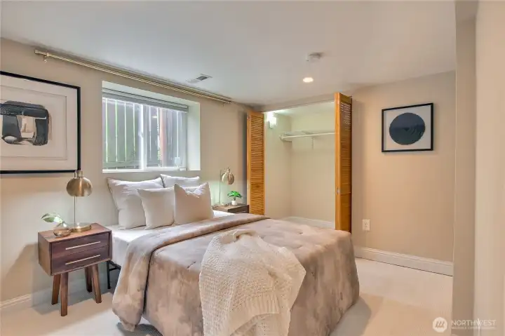 Second bedroom downstairs is spacious and easily fits a king bed.
