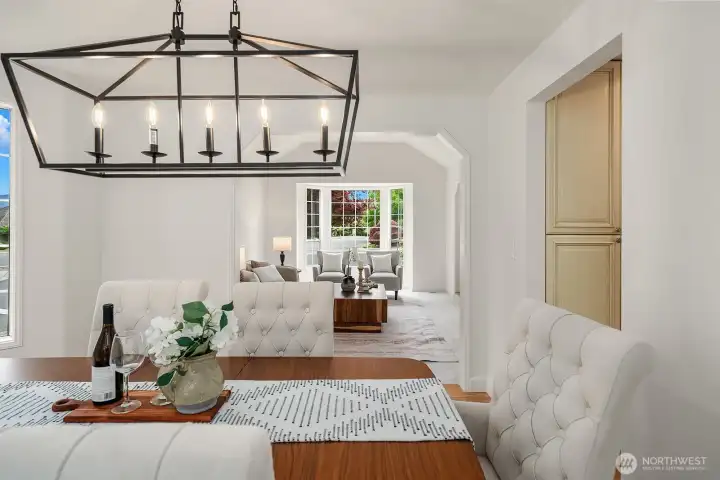 Close-up of the dining area showcasing the statement chandelier, bright natural light, and thoughtful details that give this space a warm and sophisticated character. Close-up of the dining area showcasing the statement chandelier, bright natural light, and thoughtful details that give this space a warm and sophisticated character.