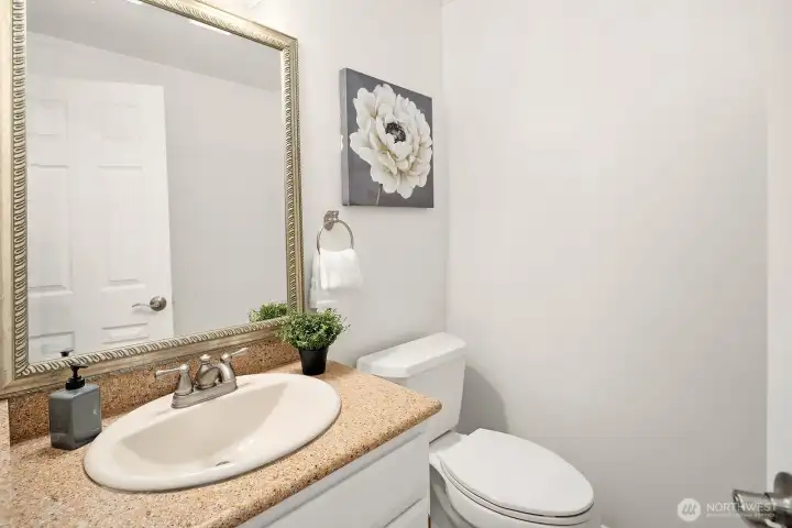 Conveniently located powder room on the main floor featuring updated fixtures and clean, fresh finishes. Conveniently located powder room on the main floor featuring updated fixtures and clean, fresh finishes.