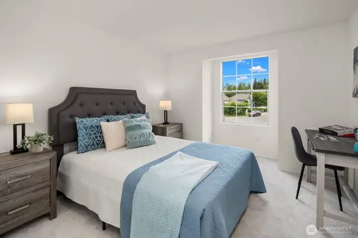 Well-appointed secondary bedroom featuring new carpet, a bright window, and a comfortable layout ideal for guests, family, or a home office. Well-appointed secondary bedroom featuring new carpet, a bright window, and a comfortable layout ideal for guests, family, or a home office.