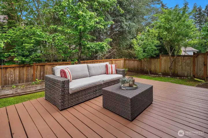Another angle of the spacious deck showcasing the fully fenced backyard, abundant mature trees, and the peaceful privacy that makes this outdoor space truly special. Another angle of the spacious deck showcasing the fully fenced backyard, abundant mature trees, and the peaceful privacy that makes this outdoor space truly special.