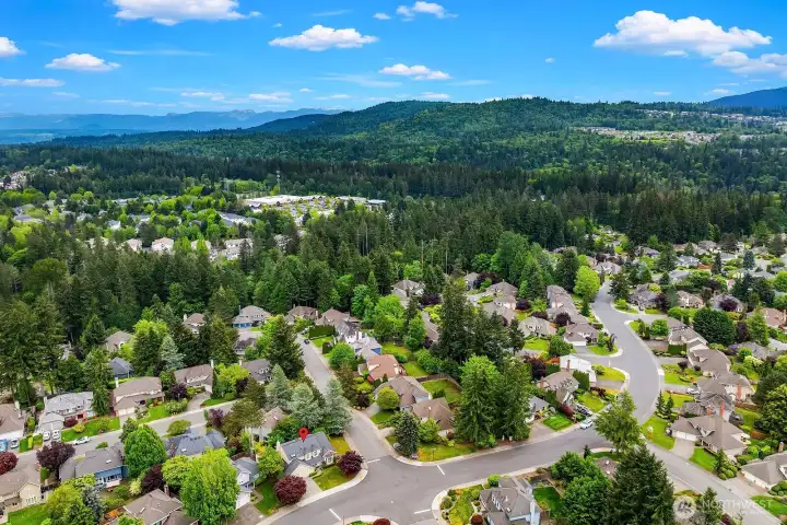 Breathtaking aerial perspective of the Klahanie neighborhood surrounded by mature evergreens and rolling hills, with stunning mountain views that define the beauty of this sought after Sammamish community. Breathtaking aerial perspective of the Klahanie neighborhood surrounded by mature evergreens and rolling hills, with stunning mountain views that define the beauty of this sought after Sammamish community.
