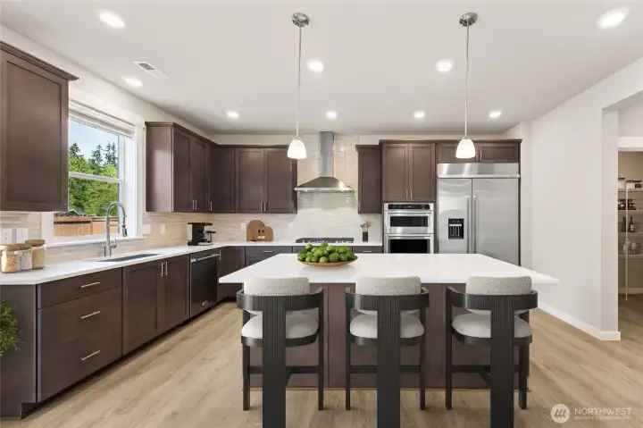 This kitchen and huge pantry offer plenty of space to entertain - Virtually staged. Cabinet color may be different than actual home. This kitchen and huge pantry offer plenty of space to entertain - Virtually staged. Cabinet color may be different than actual home.