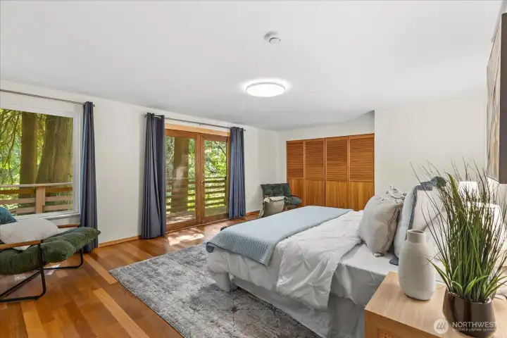 Primary bedroom with French doors to the deck